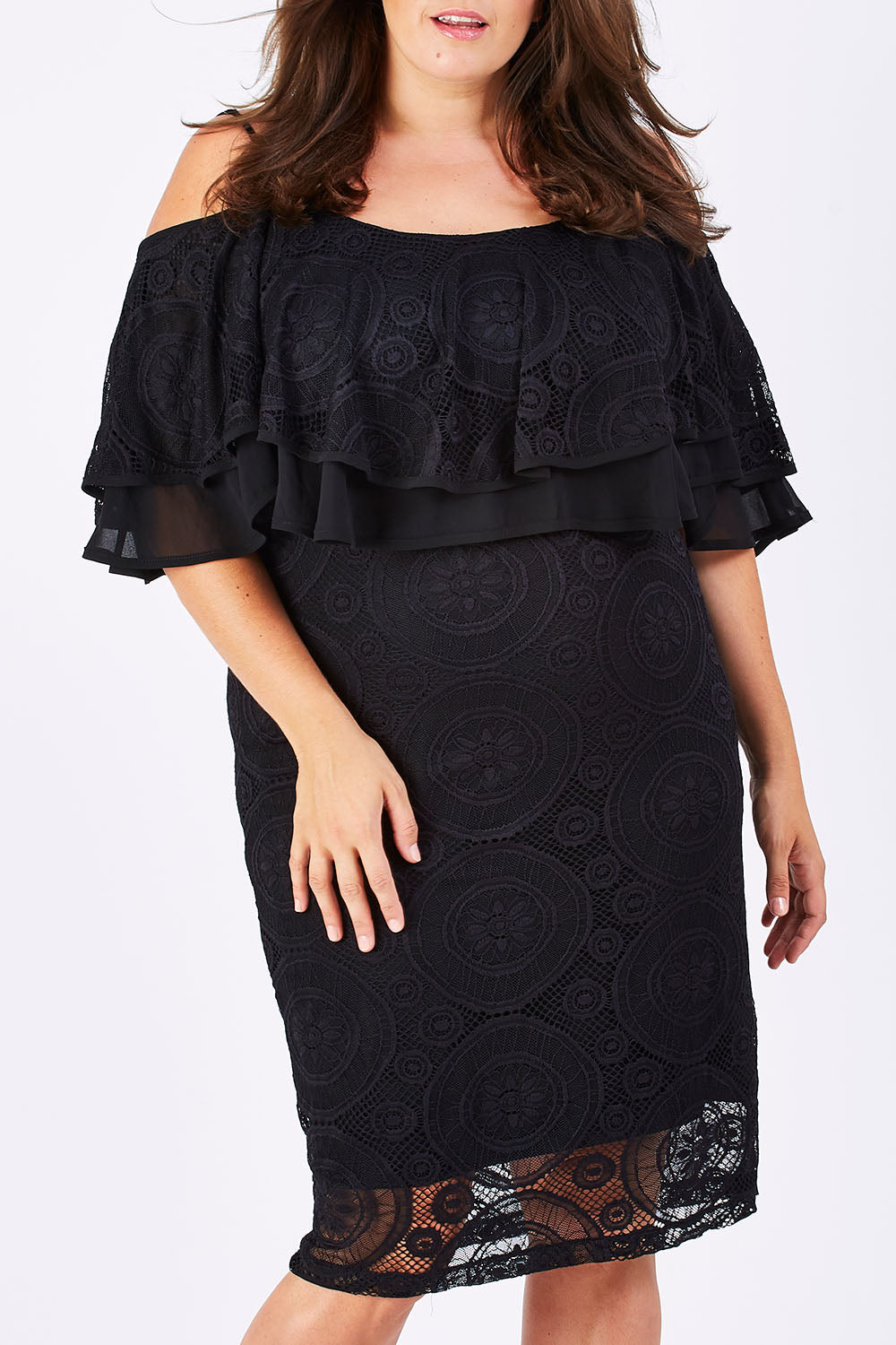 Model Mae wearing size 18 of the Suzette in colour black (Black), from the front, cropped image