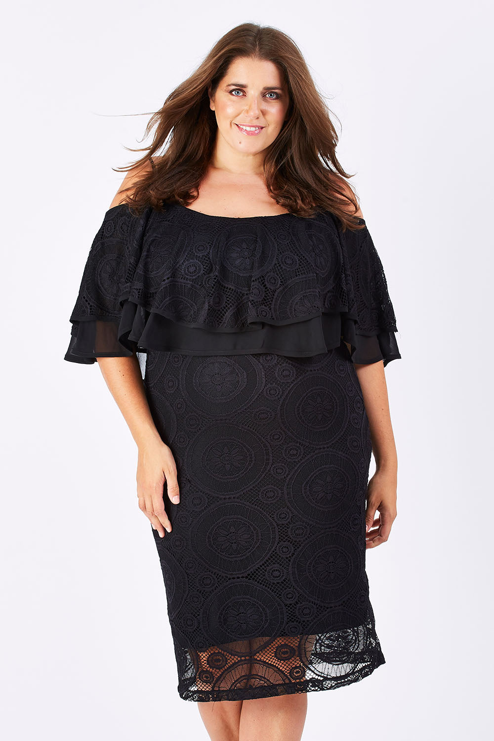 Model Mae wearing size 18 of the Suzette in colour black (Black), from the front, cropped image