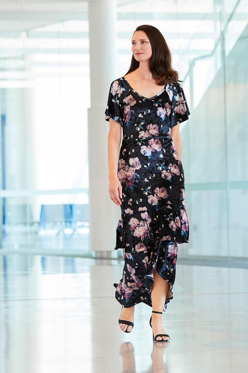 Model Anneliese wearing size 10 of the Rebecca Dress in colour WinterRose (Black), from the front, showing the whole outfit