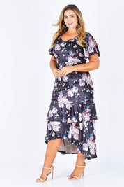 Model Fiona wearing size 16 of the Rebecca Dress in colour WinterRose (Black), from the front, showing the whole outfit