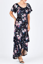 Model Rebecca wearing size 10 of the Rebecca Dress in colour WinterRose (Black), from the front, cropped image
