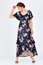 Model Rebecca wearing size 10 of the Rebecca Dress in colour WinterRose (Black), from the front, showing the whole outfit