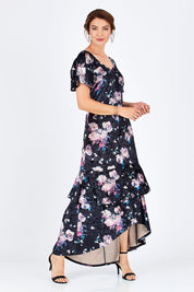 Model Rebecca wearing size 10 of the Rebecca Dress in colour WinterRose (Black), from the front, showing the whole outfit