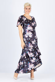Model Stefania wearing size 14 of the Rebecca Dress in colour WinterRose (Black), from the front, showing the whole outfit