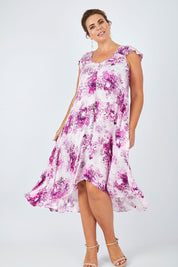 Model Fiona wearing size 16 of the Prue Dress in colour Jacaranda (Pink), from the front, showing the whole outfit