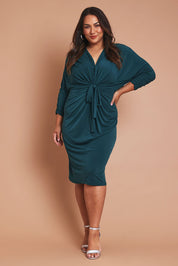 Model Ashleigh wearing size 16 of the Nancy Dress in colour Forest (Green), from the front, showing the whole outfit