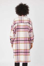 Model Olivia wearing size OneSize of the Aberdeen Jacket in colour Musk (Pink), from the back