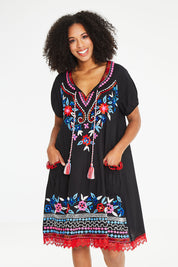 Model Schanez wearing size S of the Sao Paulo Dress Nova in colour Floralemb (Black), from the front, cropped image