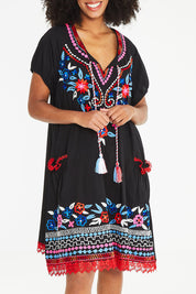 Model Schanez wearing size S of the Sao Paulo Dress Nova in colour Floralemb (Black), from the front, cropped image