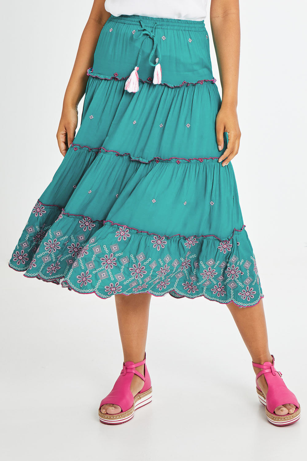 Model Olivia wearing size S of the Preloved Tiered Skirt in colour Pacific (Green), from the front, cropped image