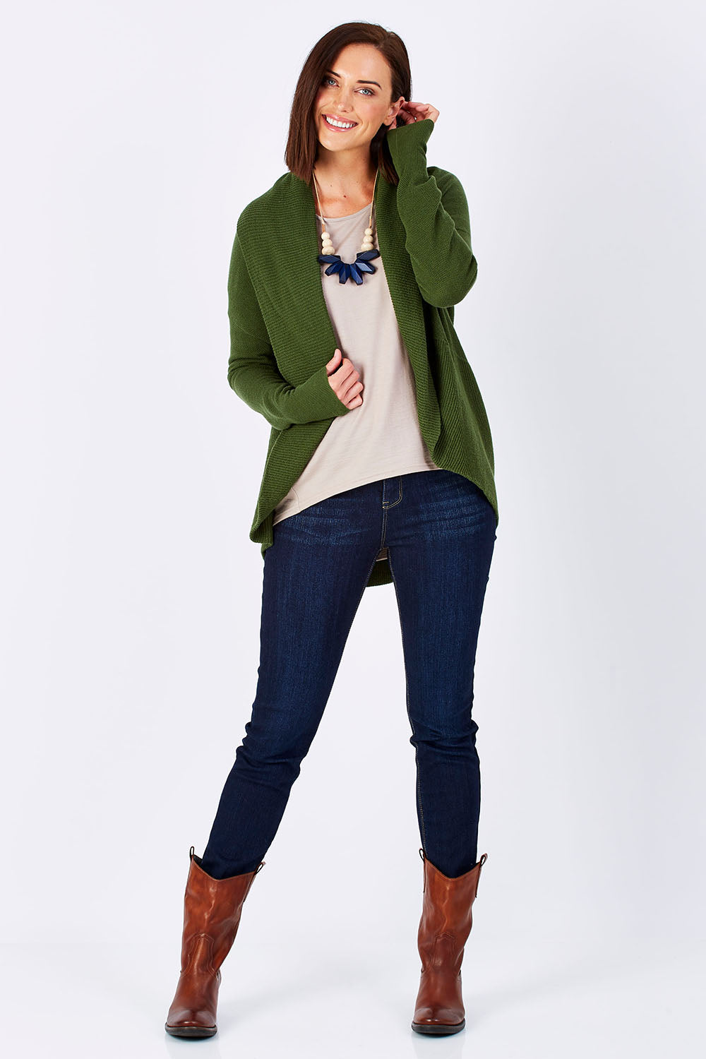 Model Perrie wearing size S of the Natural Cocoon Cardigan in colour Vineyard (Green), from the front, showing the whole outfit