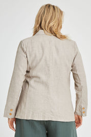 Model Keeara wearing size 16 of the Cotton Linen Longline Blazer in colour Desertsand, from the back