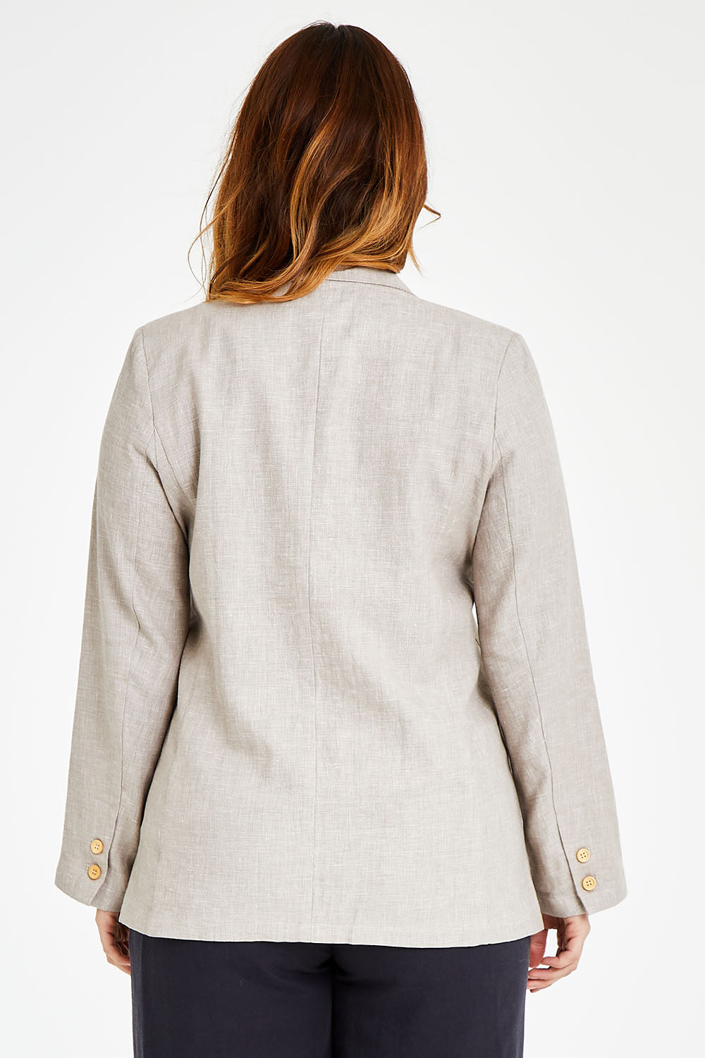 Model Laura wearing size 14 of the Cotton Linen Longline Blazer in colour Desertsand, from the back