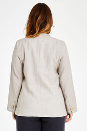 Model Laura wearing size 14 of the Cotton Linen Longline Blazer in colour Desertsand, from the back