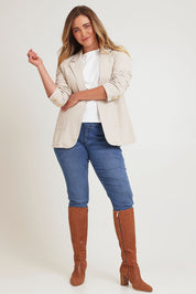 Model Chanel wearing size 16 of the Cotton Linen Longline Blazer in colour Sand, from the front, showing the whole outfit