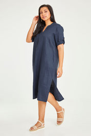 Model Noli wearing size 14 of the Preloved Linen Summer Relaxed Dress in colour Blue (Blue), from the front, showing the whole outfit