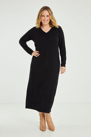 Model Jess wearing size L of the Cotton Cashmere Wool V Neck Knit Dress in colour Black (Black), from the front, showing the whole outfit