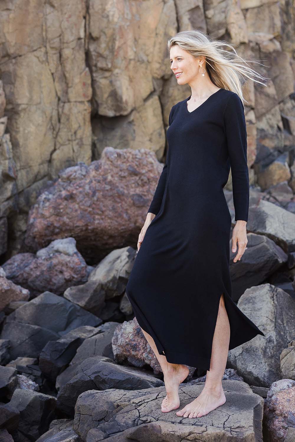 Model Kelly wearing size S of the Cotton Cashmere Wool V Neck Knit Dress in colour Black (Black), from the front, showing the whole outfit