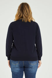 Model Jess wearing size L of the Merino Wool High Crew Pullover in colour Navy (Blue), from the back