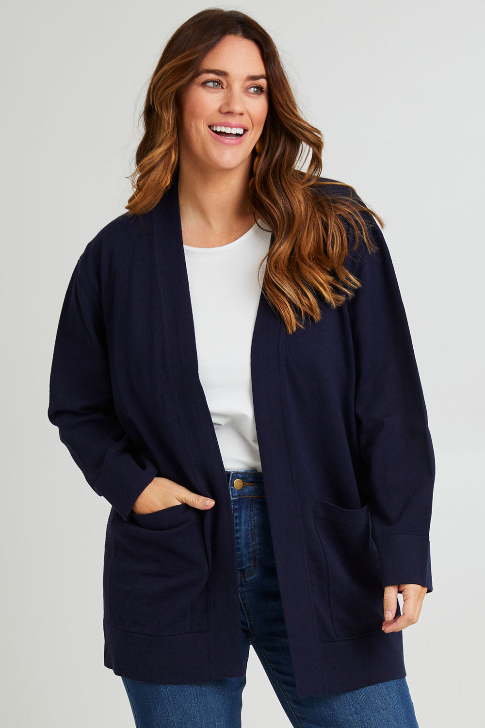 Model Laura wearing size L of the Cotton Cashmere Wool Cardigan in colour Navy (Blue), from the front, cropped image