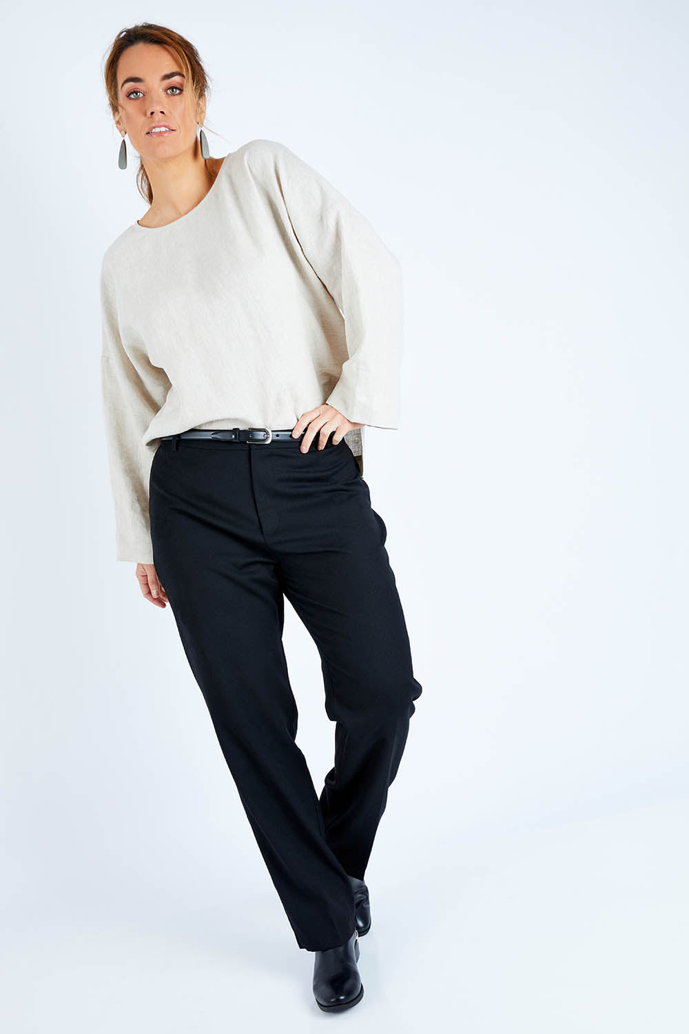 Model Laura wearing size 14 of the Wool Slim Leg Pant in colour Midnight (Black), from the front, showing the whole outfit