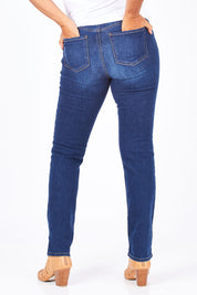 Model Nadine wearing the Sheri Slim in colour Cooper (Blue), from the back