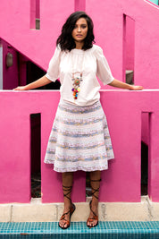 A model wearing the Bliss Top Basics in colour Mushroom, from the front, showing the whole outfit