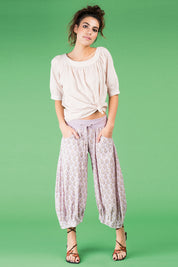 A model wearing the Bliss Top Basics in colour Mushroom, from the front, showing the whole outfit