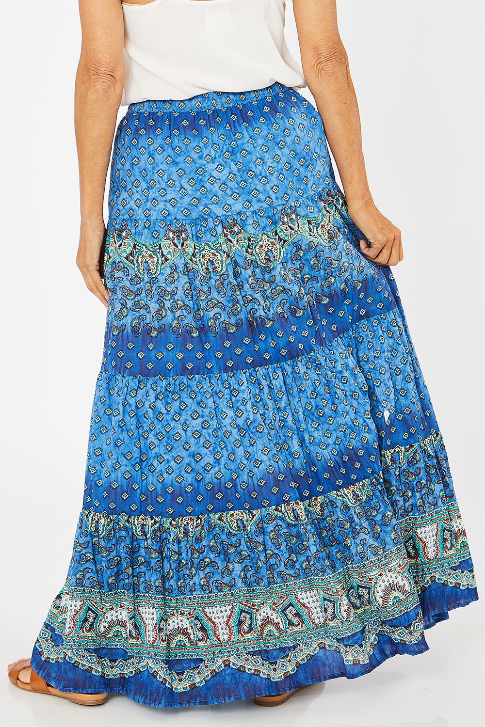 Model Rachel wearing size 10 of the Maxime Organic Cotton Crinkle Skirt in colour Print (Blue), from the back