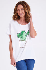 Model Emma wearing size 10 of the Embellished Tee in colour Cactuswhit (White), from the front, cropped image