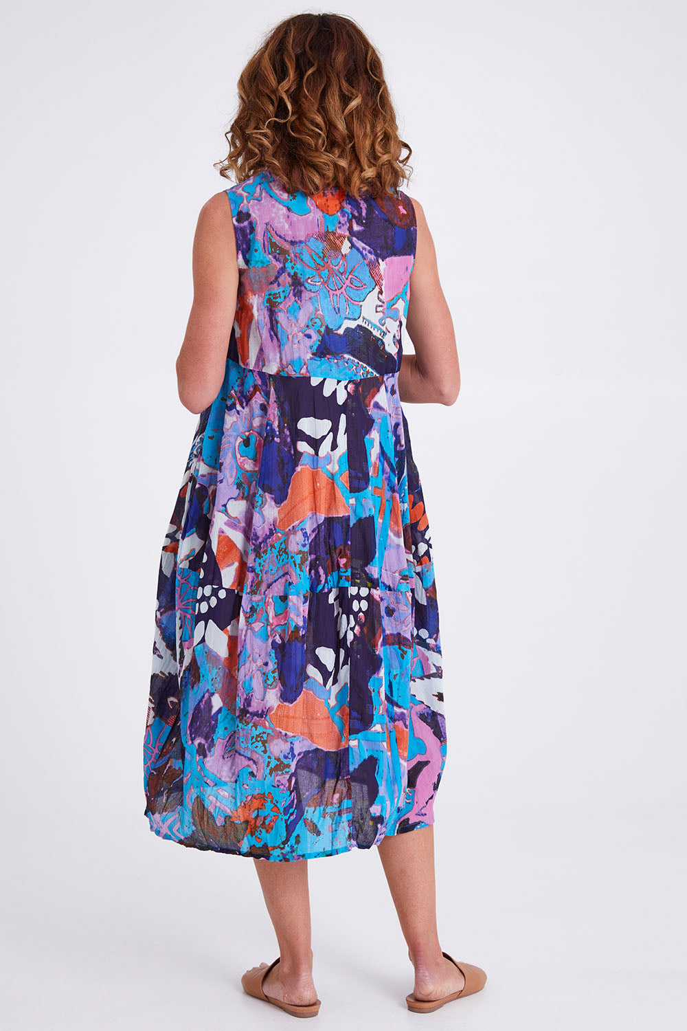 Model Emma wearing size 10 of the Printed Organic Cotton Dress in colour Orientblue (Blue), from the back