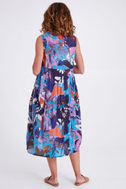 Model Emma wearing size 10 of the Printed Organic Cotton Dress in colour Orientblue (Blue), from the back