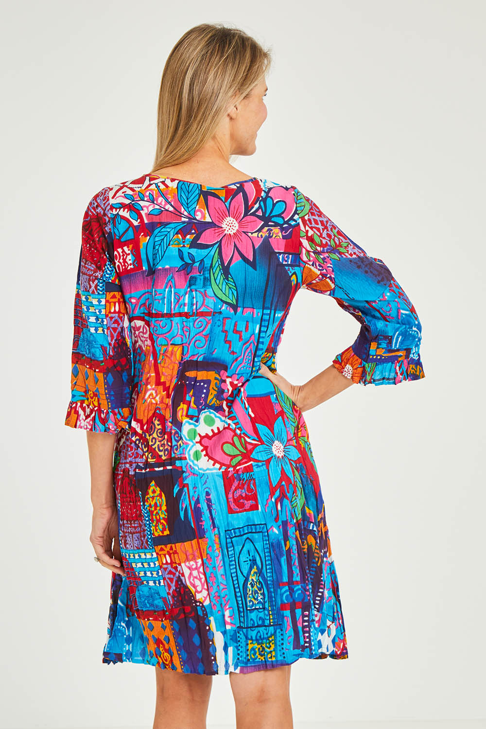 Model Kelly wearing size 10 of the Organic Cotton 3/4 Sleeve Dress in colour Marared (Blue), from the back