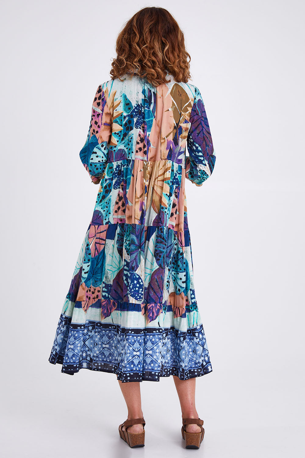 Model Emma wearing size 10 of the Agios Midi Boho Dress in colour Print (Blue), from the back