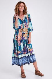 Model Emma wearing size 10 of the Agios Midi Boho Dress in colour Print (Blue), from the front, showing the whole outfit