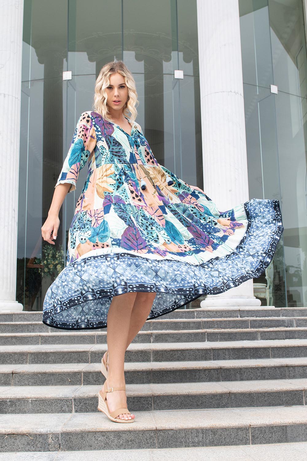 A model wearing the Agios Midi Boho Dress in colour Print (Blue), from the front, showing the whole outfit