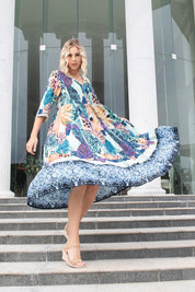 A model wearing the Agios Midi Boho Dress in colour Print (Blue), from the front, showing the whole outfit