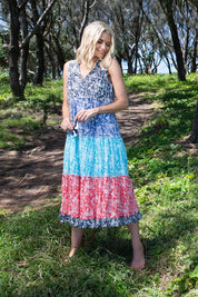 A model wearing the Cappadocia Organic Cotton Sleeveless Dress in colour Mix (Blue), from the front, showing the whole outfit