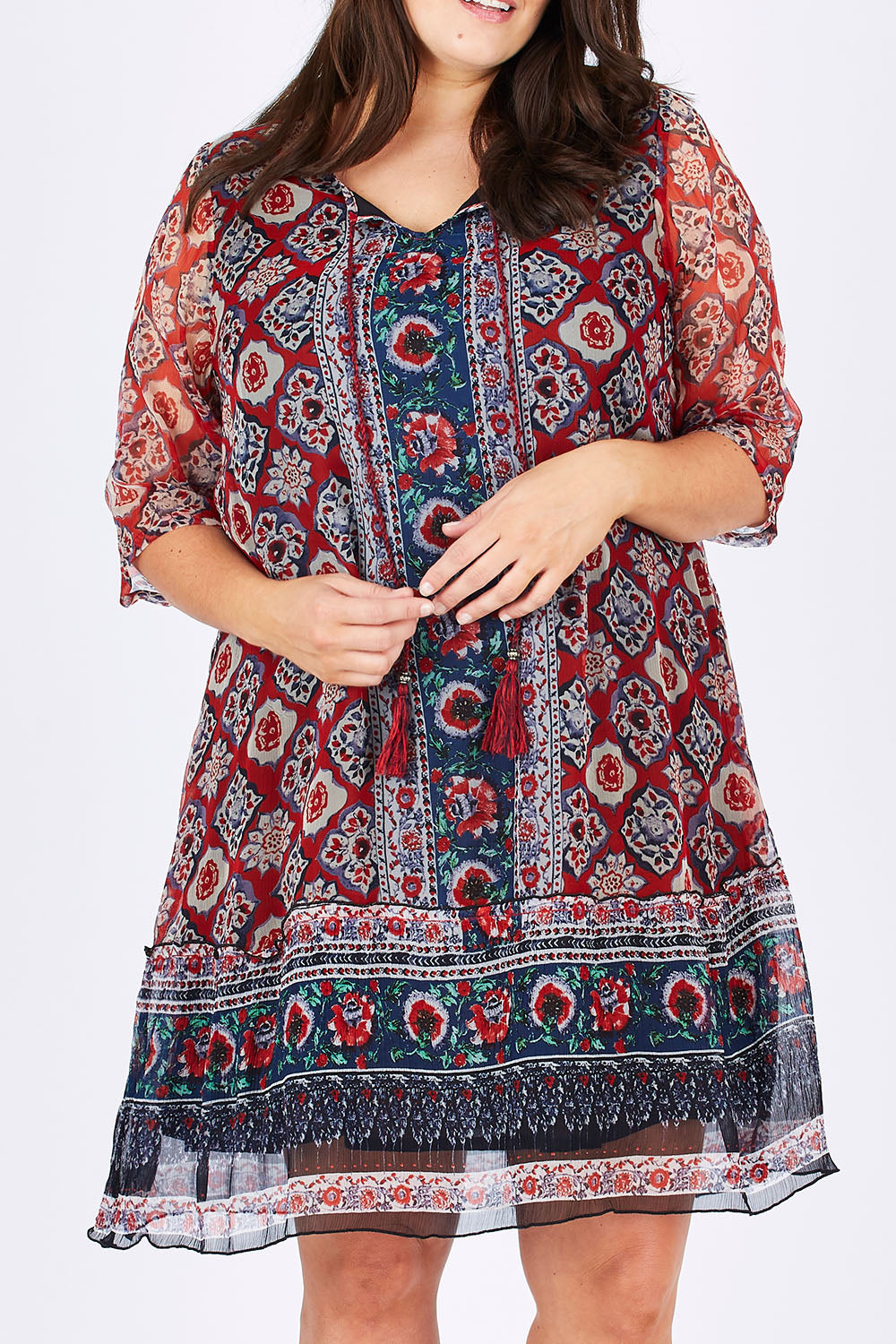 Model Mae wearing size 18 of the Urbino Print Dress in colour UrbinoPrin (Red), from the front, cropped image