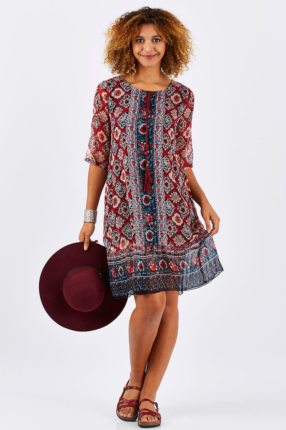 Model Summer wearing size 10 of the Urbino Print Dress in colour UrbinoPrin (Red), from the front, showing the whole outfit