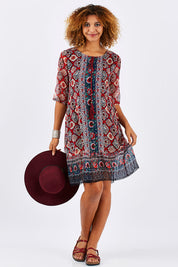 Model Summer wearing size 10 of the Urbino Print Dress in colour UrbinoPrin (Red), from the front, showing the whole outfit