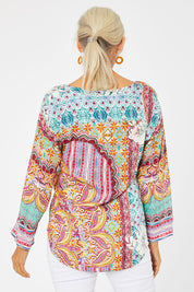 Model Rachel wearing size 10 of the Chateau Print Top in colour Print (Red), from the back