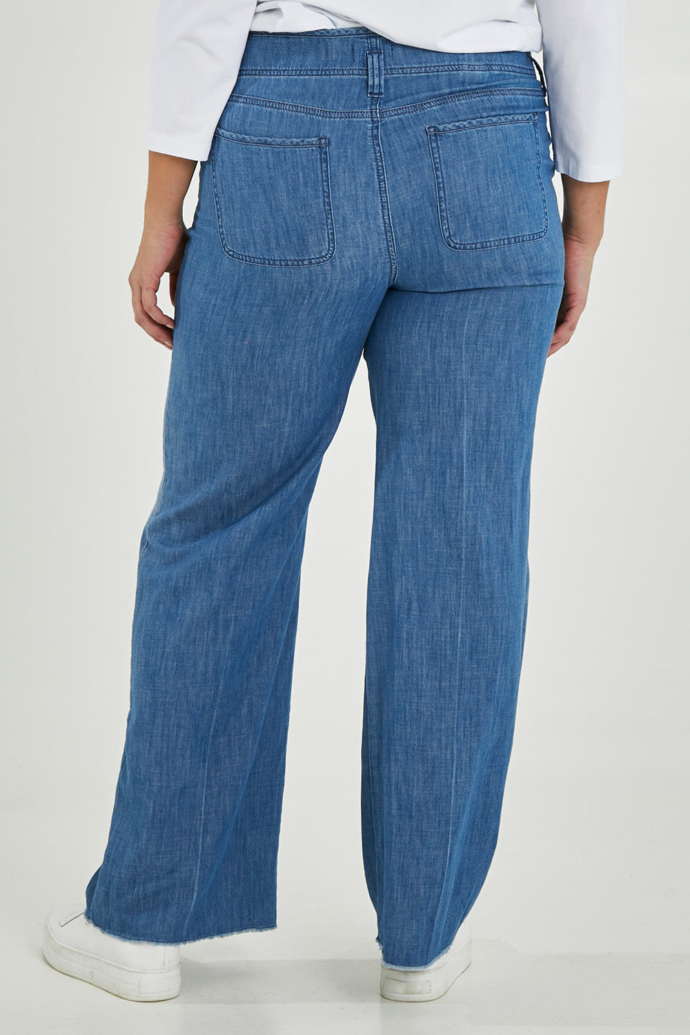 Model Maddy wearing the Higher Rise Teresa Wide Leg in colour Everly (Blue), from the back