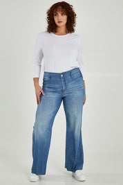 Model Maddy wearing the Higher Rise Teresa Wide Leg in colour Everly (Blue), from the front, showing the whole outfit