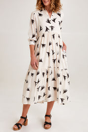 Model Emma wearing size S of the Button Shirt Dress in colour Elegance (White), from the front, cropped image