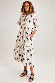 Model Emma wearing size S of the Button Shirt Dress in colour Elegance (White), from the front, showing the whole outfit