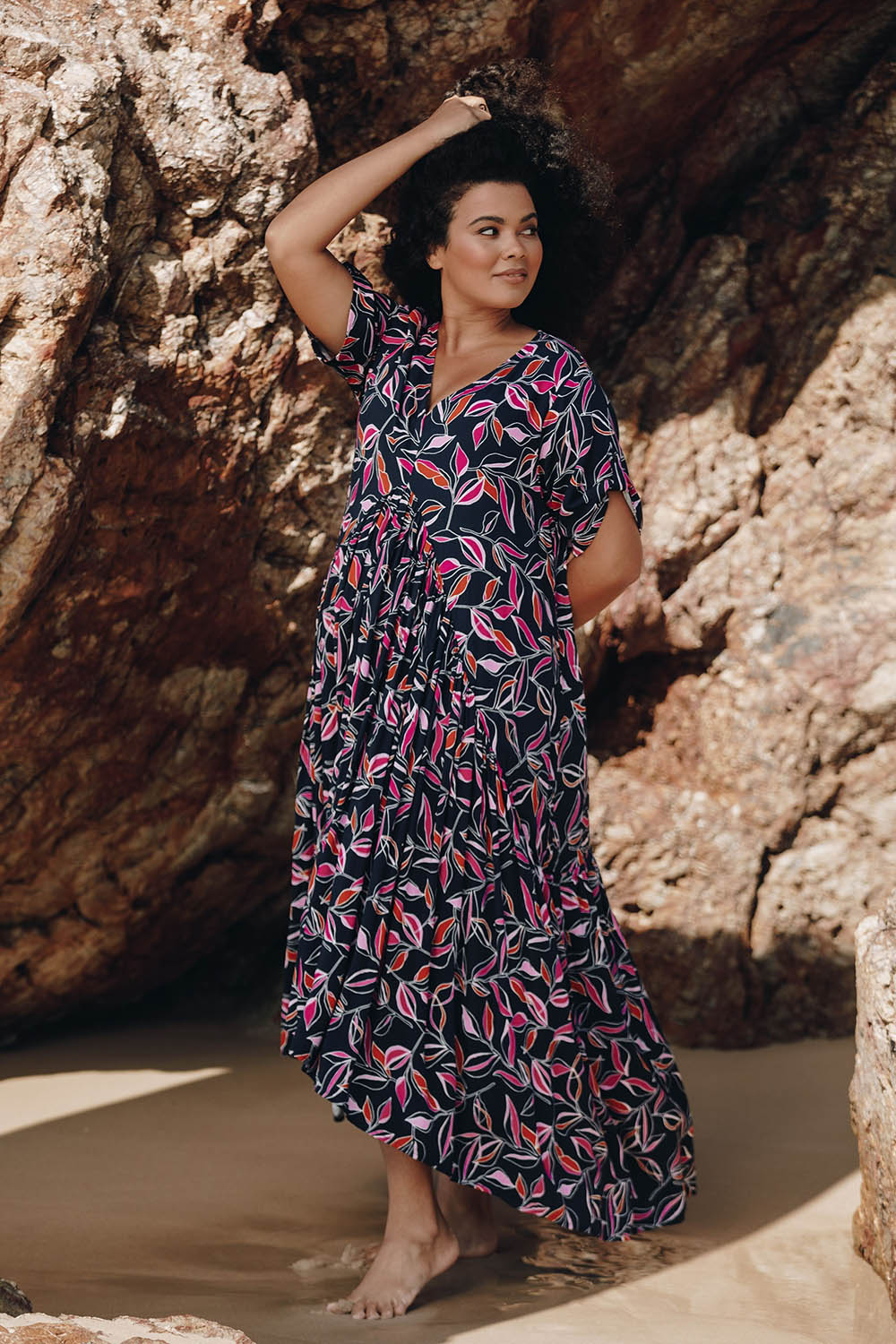 A model wearing the Botanical Night Peak Maxi Dress in colour Botanical (Blue), from the front, showing the whole outfit