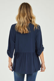 Model Alice wearing size OneSize of the Long Sleeve Bamboo Dazzle Top in colour Navy (Blue), from the back