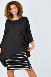 Model Summer wearing size OneSize of the Essential Top in colour Black (Black), from the front, cropped image