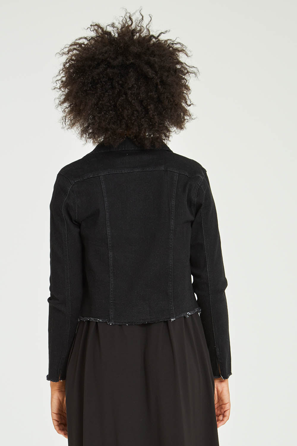 Model Olivia wearing size S of the Denim Jacket in colour Black (Black), from the back